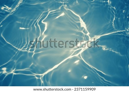  Defocus blurred transparent blue colored clear calm water surface texture with splashes reflection. Trendy abstract nature background. Water waves in sunlight with copy space. Blue watercolor shine.