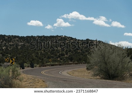 Turquoise Trail highway curve to the north from Madrid, New Mexico Royalty-Free Stock Photo #2371168847