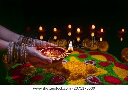 Clay diya lamps lit during diwali celebration, Diwali, or Deepavali, is India's biggest and most important holiday. Royalty-Free Stock Photo #2371175539