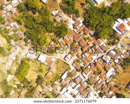 Residential Housing. Aerial drone shot landscape view of densely populated housing in a village at the foot of Mount Pangradinan - Bandung, Indonesia. Dense housing, Aerial Landscape