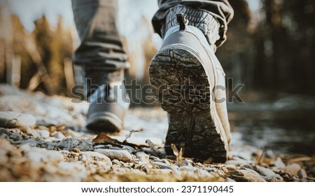 mens footsteps in the countryside  Royalty-Free Stock Photo #2371190445