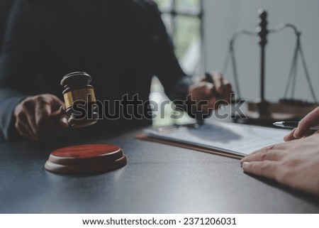 Lawyer or judge holding Hammer prepares to judge the case with justice, and litigation, scales of justice, law hammer, Legal consulting services, Concept of litigation, and legal services.