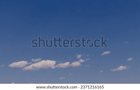 a calm cloud floating in the blue sky