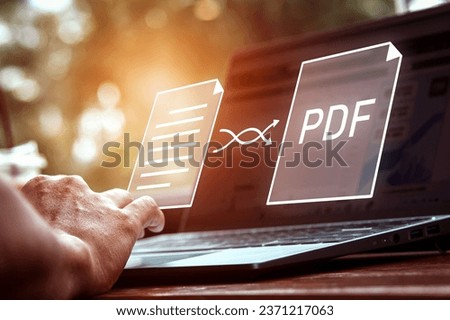 Convert PDF files with online programs. Users convert document files on a platform using an internet connection at desks. concept of technology transforms documents into portable document formats. Royalty-Free Stock Photo #2371217063