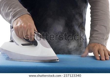 Hand of a Man Ironing with Steam