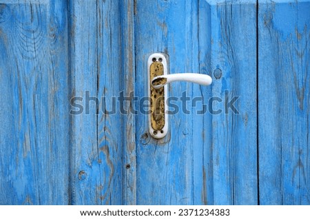 background of blue wooden door with close-up handle