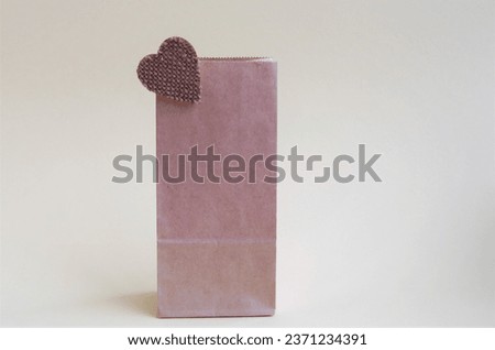 one paper brown bag with heart, minimalism