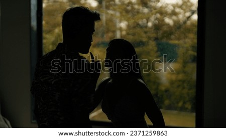 Indian stressed upset tense husband wife arguing fighting shouting on each other at dark indoor home. Silhouette angry sad boyfriend girlfriend quarreling screaming on family problems in evening house Royalty-Free Stock Photo #2371259863