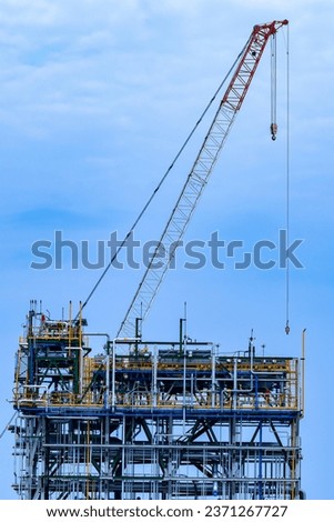 Crane building construction site.Construction site with cranes and building with blue sky background.Large Construction site including cranes working with buildings. beam, steel structure.