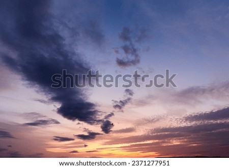End of the day concept. Beautiful clouds after sunset. Sunset Sky on Twilight in the Evening with Orange Gold Sunset Cloud. Royalty-Free Stock Photo #2371277951