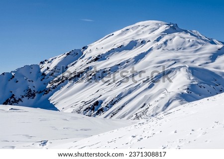 Snowy mountains in winter, Elbrus, Caucasus, Russia Royalty-Free Stock Photo #2371308817