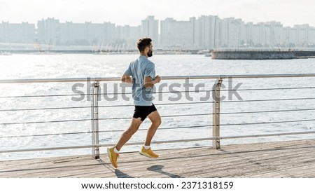 A runner doing weight loss exercises every day is a routine. Warm-up running marathon preparation, athletic man and fitness. Interval training an athlete running actively outside.