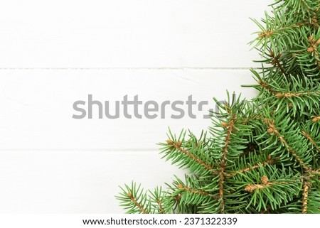 Christmas wooden background with fir tree and copy space. top view empty space for your design.
