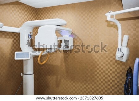 X-ray machine in dental clinic or CT scan with close up shot photography with brown background