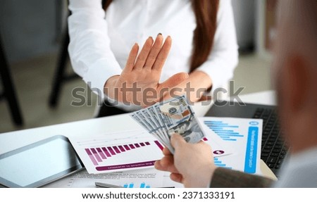 Male arm pay bunch of hundred dollars bills to office clerk closeup. Bribery accept backhander banknote venality laundering back scheme offshore company irs kickback collusion lobby gift compensation Royalty-Free Stock Photo #2371333191