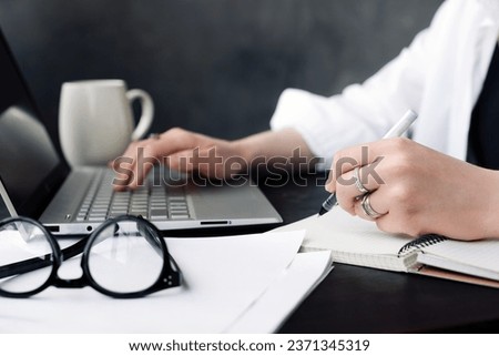 Focused Professional. Woman Journalist or Businesswoman at Work in Office. Strategic Planning. Woman Professional in Office Environment. Dedicated Journalist in Action. Woman at Office Workspace. Royalty-Free Stock Photo #2371345319