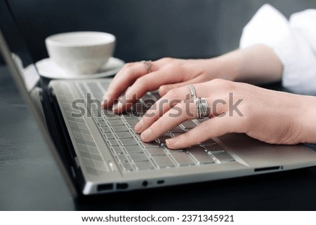 Online Learning and Internet Marketing. Female Hands on Keyboard. Student or Professional. Female Hands Engaged in Online Work. Freelancer's Office. Female Hands on Computer Keyboard