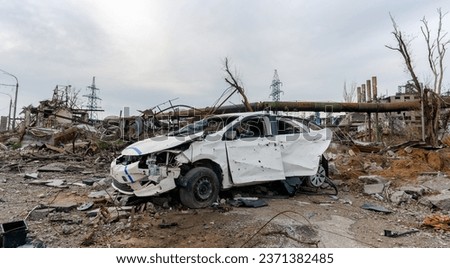 burnt cars and destroyed buildings of the workshop of the Azovstal plant in Mariupol war in Ukraine with Russia Royalty-Free Stock Photo #2371382485