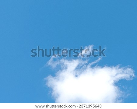 a photo of clouds in a clear summer sky 