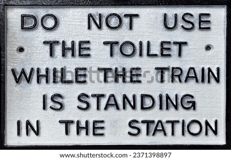 Vintage British railway sign - Do not use the toilet when the train is in the Station