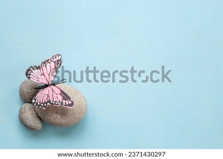 Calmness and harmony background with marble stones and butterfly. Maditation and relaxation concept. Royalty-Free Stock Photo #2371430297