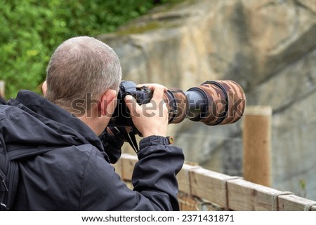 Male photographer taking a picture                           