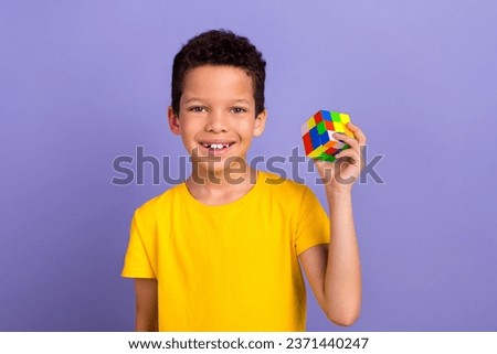 Photo of intelligent nice boy wear yellow trendy clothes hand hold colorful cube isolated on purple color background Royalty-Free Stock Photo #2371440247