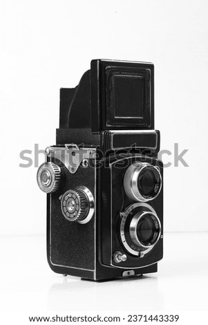 Old vintage  photo camera on white background,Photo the old photo camera,Old style photographic camera item,Vintage camera,Vintage photo camera,Old camera on white background isolated,Vintage camera Royalty-Free Stock Photo #2371443339