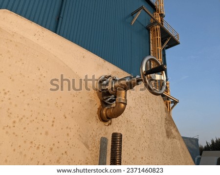 Rotating handle for gearbox of traveling band screen intake system. The photo is suitable to use for industry background photography, power plant poster and electricity content media.