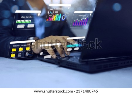 Businessman working with multi task dashboard on laptop computer, downloading, search engine, data analysis, data transfer via ai assistance. Technology and business analytic.