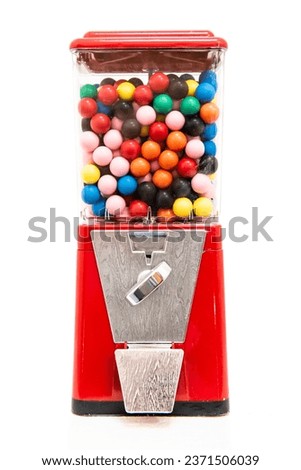 Traditional coin-operated gumball machine filled with multi coloured balls of chewing gum gobstoppers jawbreakers Royalty-Free Stock Photo #2371506039