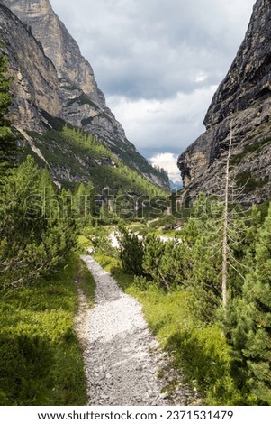 Valley Val Travenanzes and path way rock face in Tofane gruppe, Alps Dolomites mountains, Fanes national park, Italy Royalty-Free Stock Photo #2371531479
