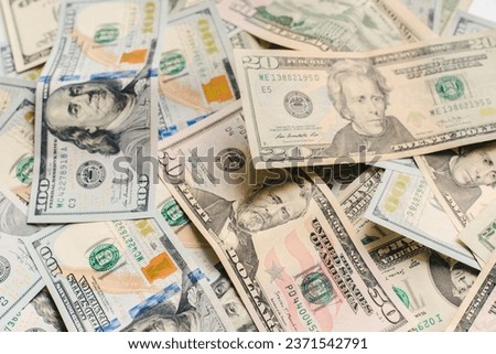 Background from American dollars. American dollars of different denominations. Currency exchange.