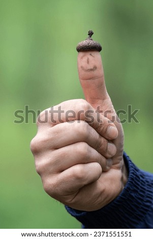 A hand that shows OK and the thumb has a small thimble