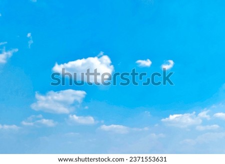 Beautiful blue sky and white clouds of various shapes with sunlight. Nature background Royalty-Free Stock Photo #2371553631