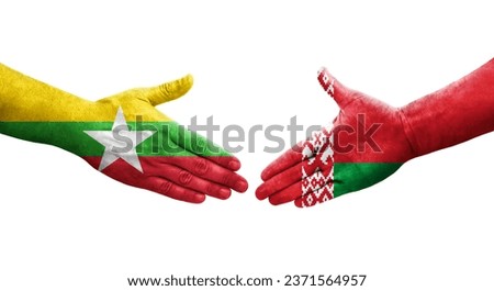 Handshake between Belarus and Myanmar flags painted on hands, isolated transparent image.