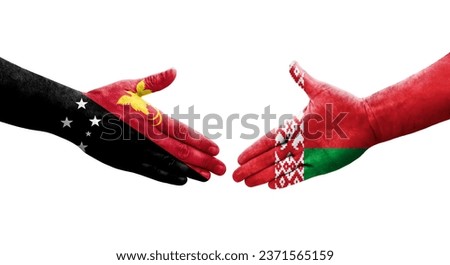 Handshake between Belarus and Papua New Guinea flags painted on hands, isolated transparent image.