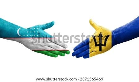 Handshake between Uzbekistan and Barbados flags painted on hands, isolated transparent image.