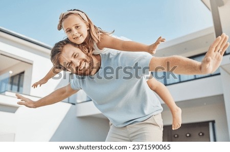 Portrait, girl and flying on back of her dad in a backyard of a home for real estate or property ownership. Love, children or family with a father and daughter in celebration of financial freedom Royalty-Free Stock Photo #2371590065