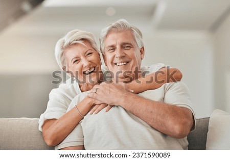 Happy senior couple, portrait and hug on living room sofa for embrace, relationship or love at home. Mature woman hugging man with smile in happiness for care, support or trust together in house Royalty-Free Stock Photo #2371590089