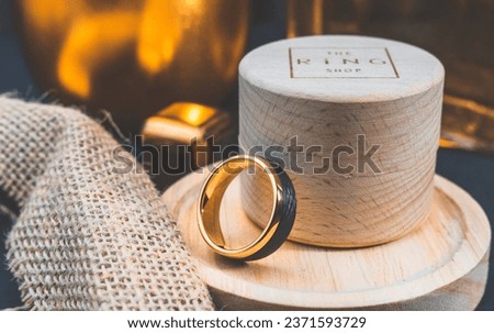 Shiny Golden Carbon Fiber Ring with beautiful lighting and reflections