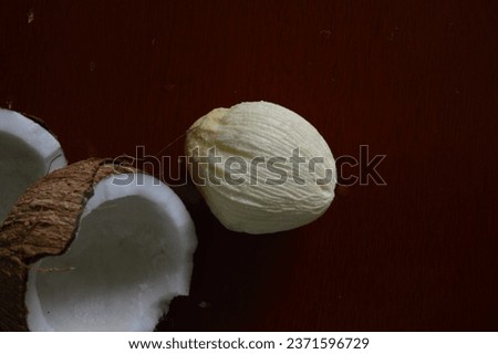 Exotic fruit known as coconut apple or coconut crumb on rustic wooden board. Maçã do côco 