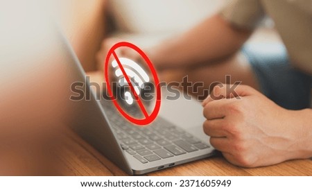 Technology concept of wifi connected but no internet. Man using a laptop computer to connect to wifi but wifi not connected or password is incorrect and waiting to loading digital data form website. Royalty-Free Stock Photo #2371605949