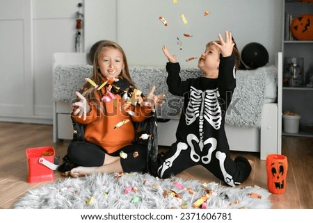 The kids enjoy candy collected for Halloween