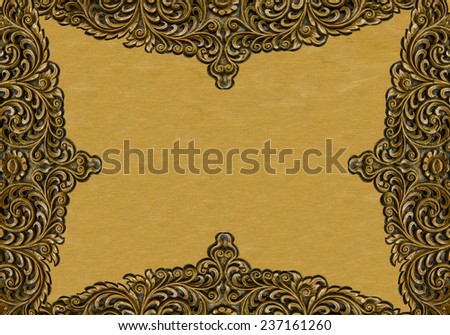 Pattern of wood carve flower frame on wood background.