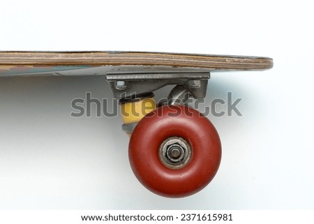 Skateboard. Penny board. Small cruiser board. Wooden board. Vintage skateboard concept. Used penny board close up view on white background. 