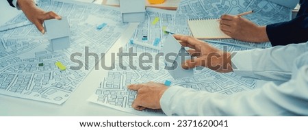 Worker, architect and engineer work on real estate construction project oratory planning with cartography and cadastral map of urban town area to guide to construction developer business plan of city Royalty-Free Stock Photo #2371620041
