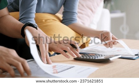 Rising high cost of living in low poor income asia people family. Past due bill debt home loan money issue young adult asian couple man woman worry shock sad tired stress in raise tax rate crisis Royalty-Free Stock Photo #2371621851