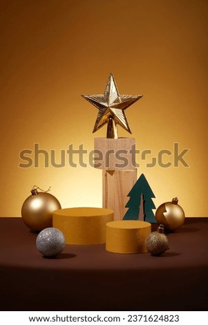 Two yellow podiums in cylinder-shaped arranged with few baubles and a christmas tree. Modern minimal showcase scene for cosmetic products promotion