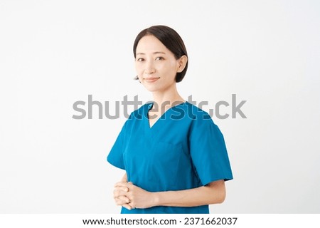 Portrait of Asian middle aged doctor in white background